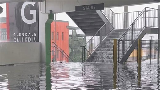 Shopping mall parking lot floods as heavy rainfall hammers Southern California
