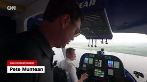 CNN reporter attempts airshow maneuvers in the Goodyear blimp