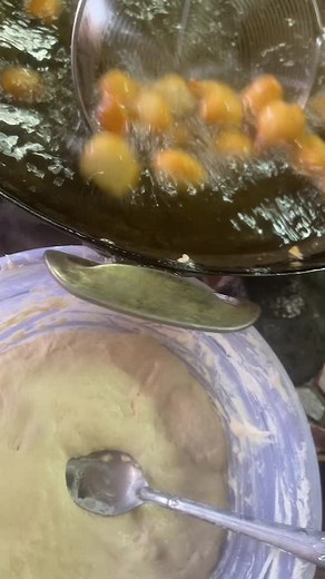 Frying Orange Fruits and Vegetables in Hot Oil