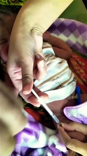 Injecting vaccine dose to newborn baby boy #babycare#newbornbaby#injection#cutebabies