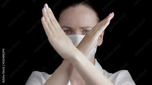 Medical lab worker with protective sterile face mask showing stop sign on hospital. Coronavirus (2019-nCoV). MERS chinese infection, atypical pneumonia. Anti-virus human health concept.
