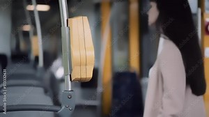 yellow ticket scanner in tram or bus. Woman electronic ticket to pay for public transport. The girl pays for the trip.