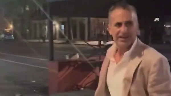 Jonathan Kaye, millionaire banker accused of slugging woman at Brooklyn Pride event, heckled by protesters after getting charged with assault