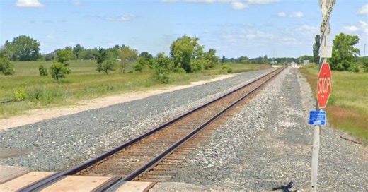 Garbage truck driver severely injured after collision with train