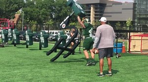 CSU football fullbacks, running backs push sled in practice