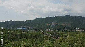 Jinzhong, Shanxin Province, China, DF4 passenger train srunning on the North Taiyuan-Jiaozuo (Taijiao) Railway in Taihang mountain.