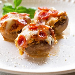 These Pizza Stuffed Mushrooms are a low-carb and keto-friendly appetizer filled with a creamy pizza filling made with pepperoni, sausage, pizza sauce, and cream cheese. RECIPE: https://www.the-girl-who-ate-everything.com/pizza-stuffed-mushrooms/ | The Girl Who Ate Everything