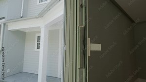 The wide window in the house is open for ventilation. Close up, move camera