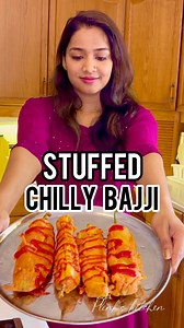 🌶️ Chilli Bajji Recipe: Ingredients: 🌶️3 large green chillies 🌶️1 cup besan (gram flour) 🌶️3 tablespoons rice flour 🌶️1/2 teaspoon turmeric powder 🌶️1 teaspoon chilli powder 🌶️Salt to taste 🌶️1/4 teaspoon asafoetida powder 🌶️1/4 teaspoon baking soda 🌶️Water (as needed for batter consistency) 🌶️Oil for deep frying Instructions: 1. Halved Cut: 🌶️Slit the green chillies in half, removing seeds if desired. 🌶️In a bowl, mix besan, rice flour, turmeric powder, chilli powder, salt, asafoet