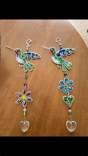 Joann M Reid-Williams on Instagram: "I've been staying busy working on hummingbirds. Wirewrapped beaded hummingbird suncatcher's with beaded flowers. #suncatcher"