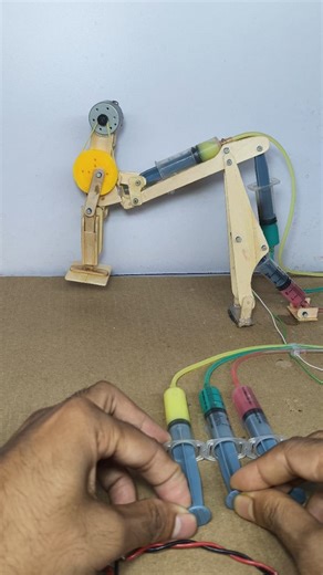 2.9M views · 11K reactions | Hello friends, how are you? Here is a new video. In today's video, I have made a hydraulic machine that will level the high and low ground with the help of the machine. I have made it in a small type. You can use this method. To make it, you need an injection, ice cream stick, electric DC motor, battery, etc. | The magic project | Facebook