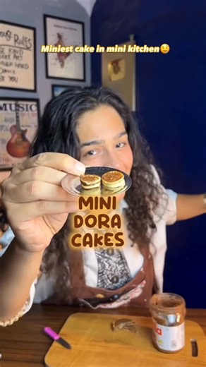 CraftShala on Instagram: "DORA CAKE is an emotion🤤🥺and making it this small was therapy🤌🏻 I still remember, when i was a kid probably 5-6 yrs old, I used to write all the recipes in a recycled notebook which me and mommy made with rough and leftover pages and notebooks. From named it “Cook Book” to actually filling it with all the recipes from (Mummy ka magic/ Sanjeev kapoor cooking shows/ Rest is cooking episodes in cartoons) Cooking is my hobby and making it content is crazyyy, I’m gratefu