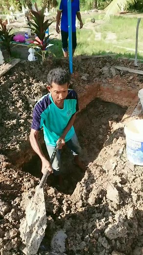Manual Labor: Digging a Trench for Construction