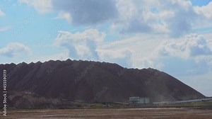 Mining industry with dust. Terricons and potash waste heaps, extraction of salt and potash fertilizers in a quarry and processing of ore