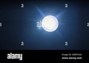 A bright circular LED light flashes repeatedly against a pitch-black background with blue lens flares. Concept of emergency signaling, electrical malfunction, and dramatic strobe effects Stock Video Footage - Alamy