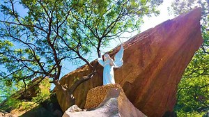 Download Bell Rock Along with a Statue - Backwards Shot for free