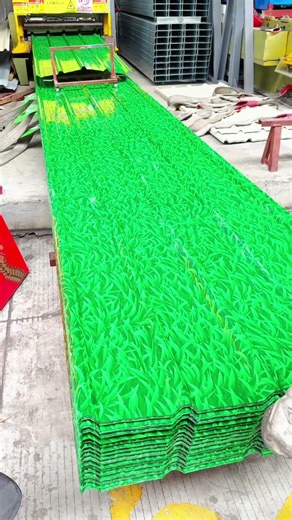 Industrial Efficiency: Worker Handles Steel Sheets Perfectly