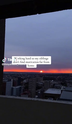 Serene Sunset Over Cityscape: A Reflective View