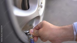 Hand people inflate tires car for safety transportation, close up checking tyre rubber car by vehicle pressure autumotive pump, service safety for transport mechine Stock Video