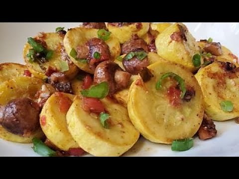 Sautéed Yellow Squash With Baby Bella Mushrooms Onions and Tomatoes.