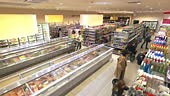 Elevated supermarket timelapse with people on the move while browsing...