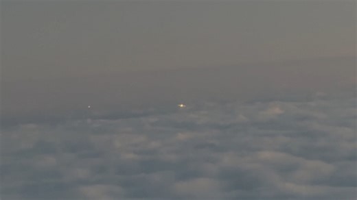 Light orbs spotted in the sky during Chicago to Newark flight, USA