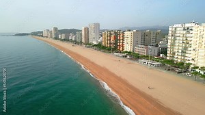 Aerial images of the seafront of Playa de Aro on the Costa Brava in Girona blue sky sunny day in summer beach without people