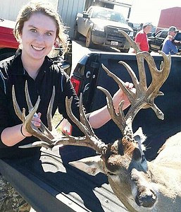 Young female hunter takes massive buck