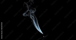 Real smoke on a black background. Thin Flexible Trickle of Real Smoke. Colorful real smoke rises up. Ideal for background or over-layer with blending mode add, screen, lighten.