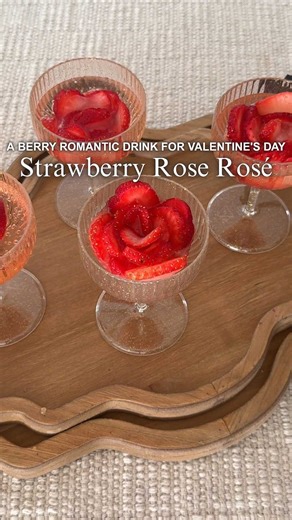 Strawberry rose drinks you'll love berry much for Valentine’s Day! SHARE this party drink idea! The moment those strawberry roses hit a champagne coupe glass, the entire space suddenly feels romantic, thoughtful, and totally elevated. These strawberry rose ice cubes add the sweetest glow up to any Valentine’s Day party ideas and they’re perfect for anyone who wants stunning Valentine’s Day drinks or a gorgeous mocktail without spending designer prices or hours prepping. A splash of rosé or sprit