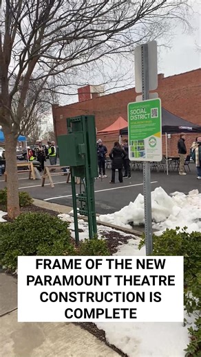 Community members gathered to sign the final steel been during a ceremonial topping out - a tradition that celebrates the completion of a building’s structural frame