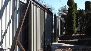 opening automatic metal gates on a remote control in a private house