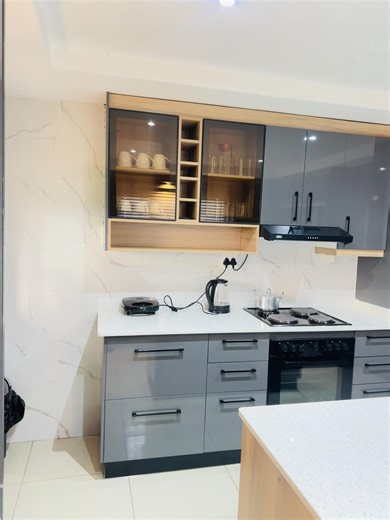 Modern Grey Gloss Kitchen with Ali Doors by Phakathwayo