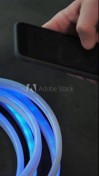 Led strip. close-up. neon tape, lamp. Controlling lighting device with an app in smartphone. dynamic, color changing mode of RGBW led strip. New lighting technology, saving energy. Shop of lighting eq