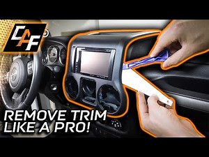 Disassembly of the central dashboard panel on the Jeep Wrangler