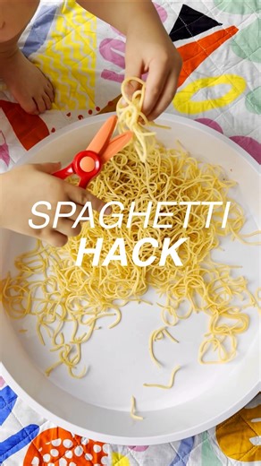 Adriane | Kids Activities, Hacks & Products on Instagram: "🌈 The easiest hand strength boost for scissors ✂️ My son has been struggling to use scissors, so we’ve been working on his hand strength with these training scissors. I saved leftover spaghetti from a couple meals and used it for this quick cutting setup. It’s soft enough for easy success but still gives their hands real work. You can always use this with regular kids scissors too. Takes seconds to put out and keeps little hands busy wi
