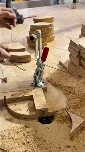 cutting small curved wooden pieces with a fixed machine blade