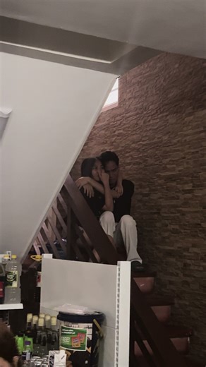 Intimate Moments: A Couple's Embrace on a Staircase