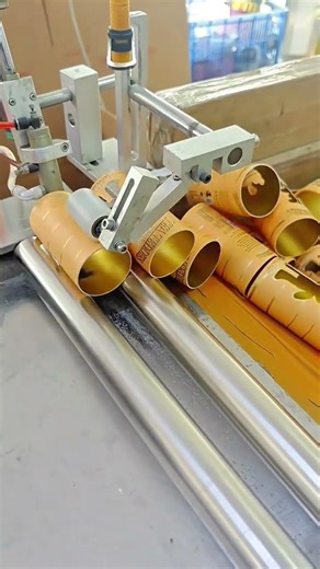 Automated Machine Precisely Cutting and Aligning Paper Tubes on Industrial Conveyor Line