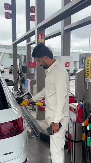Refueling a Modern Audi Sedan at the Gas Station
