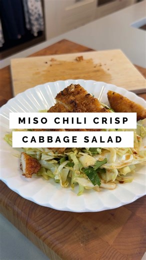 Miso chili crisp salad recipe below 1/2 a cabbage (makes ~2 servings) 1 tbsp white miso 1-2 tbsp chili oil 1 tbsp rice vinegar 1 tsp soy sauce 1-2 tsp sesame oil 2 tsp maple syrup 1/4 tsp fish sauce (optional) 1. Mix the ingredients for the dressing and set it aside 2. Thinly slice the cabbage. A veggie shaver also works well to create thinly sliced cabbage. 3. Coat well with the dressing 4. Garnish with cilantro, roasted sesame seeds, almonds, and/or chopped scallions. Top with choice of protei