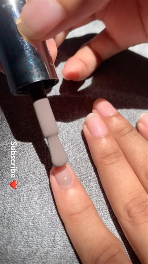Applying purple color nail polish 💅🏻