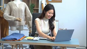 Fashion designers at work. beautiful young woman working in fashion design studio.
