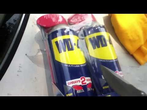 Spraying WD-40 On Car Window