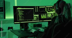 Cyber security hacker code harmful software to exploit vulnerability in program or system in dark room