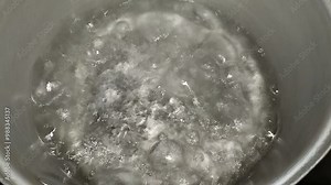 Boil water in a pot with bubbling water