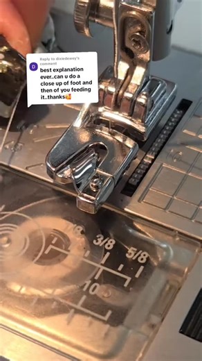 **Close-up view of how we feed fabric into a rolled hem foot after stitching forward and back to anchor the edge. That little back-stitch keeps the starting point stable so the foot doesn’t swallow your fabric. Once the anchor is locked in, we run two threads through the machine for maximum precision: Thread 1 builds the structure and keeps the curl tight. Thread 2 refines the fold and catches every micro-turn of the roll. With a steady guide, the fabric slips into the curl, lifts itself, and ro