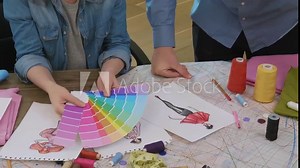 Fashion designers choosing color palette for new dress design