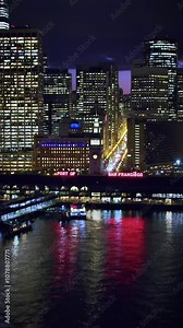 Aerial view of the San Francisco Ferry building with its clock tower. Famous piers. Financial District and the Coit tower. Shot on Red weapon 8K. California, United States.