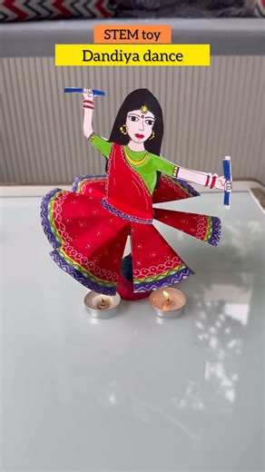 Shraddha Fogla 🇮🇳 on Instagram: "#save Dandiya dance free printable NAVRATRI PART 1 Comment “STEM” for a free printable You need to: A4 and A3 sheets of paper , coloured pens , glue , paper straw , play doh, skewer , scissor and tea candles . To make : cut the prints and then insert scissor and make 3 cuts in a paper straw ( the black one you see in the video) Paste this on the behind and then fold make triangular folds on the circular paper folding it inward on the back side . Once cut fold t